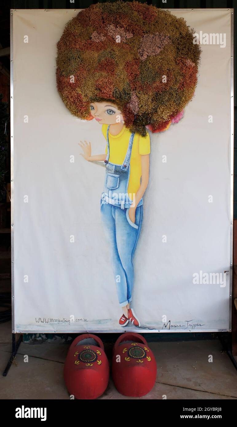 October 6, 2021. Holambra, São Paulo, Brazil. Art of a girl with flower hair in a square. Stock Photo