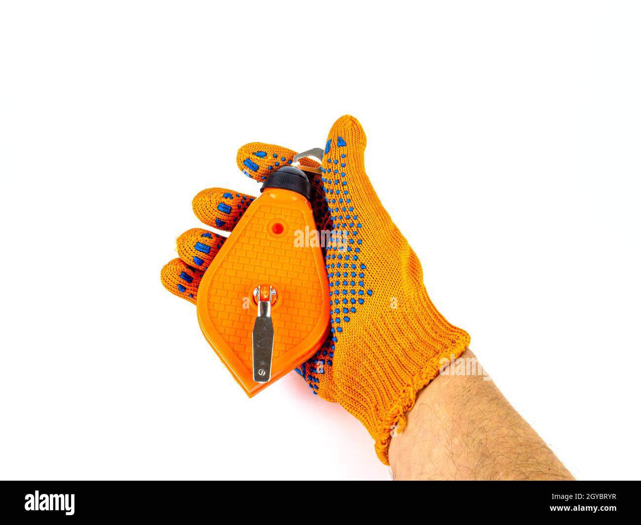 Chalk thread for marking the surface of the walls in the hand of the