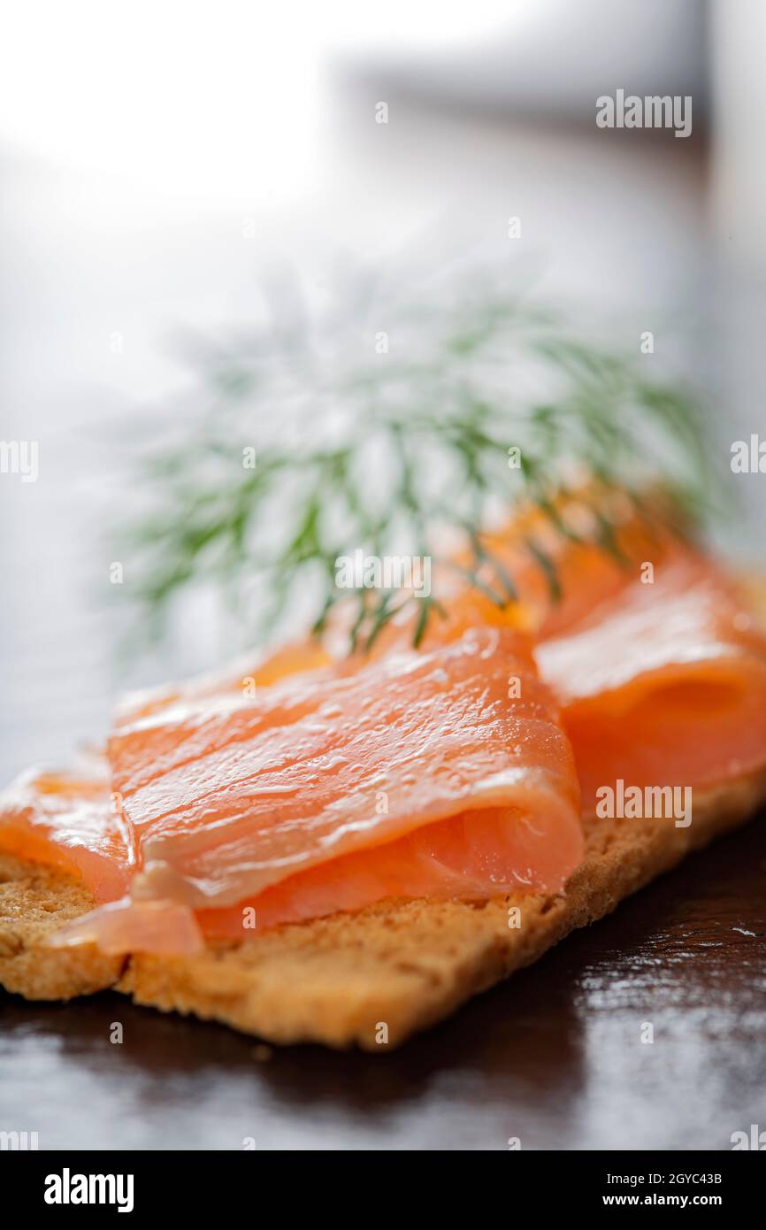 Smoked salmon on cracker with dill close up view Stock Photo Alamy