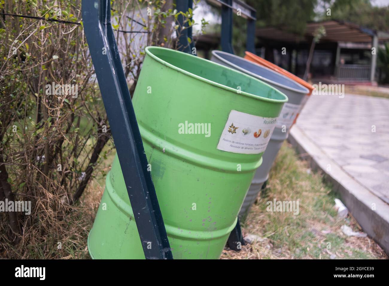 Three colorful trash cans in park from Mexico City Stock Photo Alamy