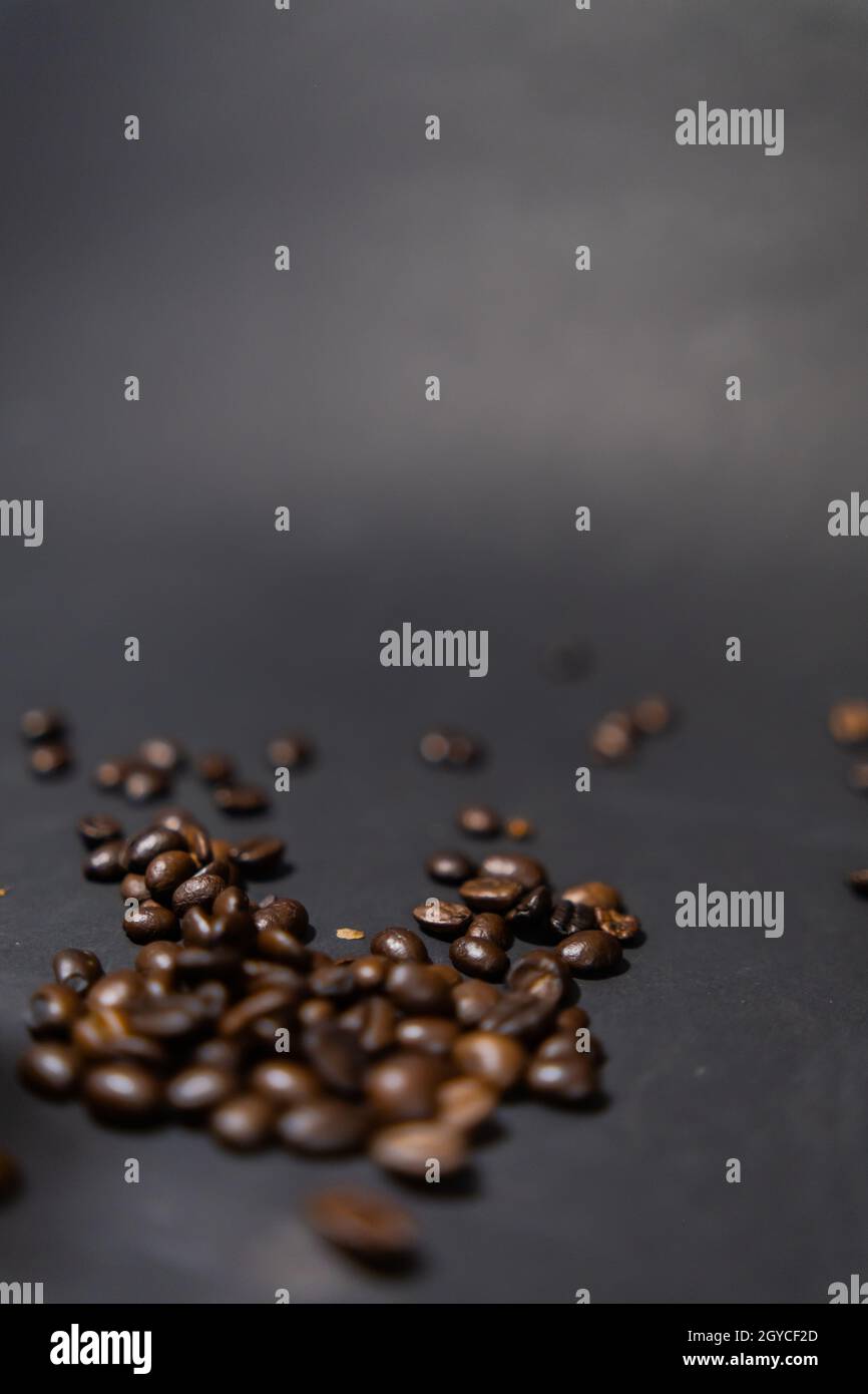 Pile of roasted coffee beans with dark gray background Stock Photo - Alamy