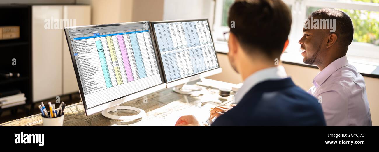 Spreadsheet Data On Computer Monitor In Office Stock Photo