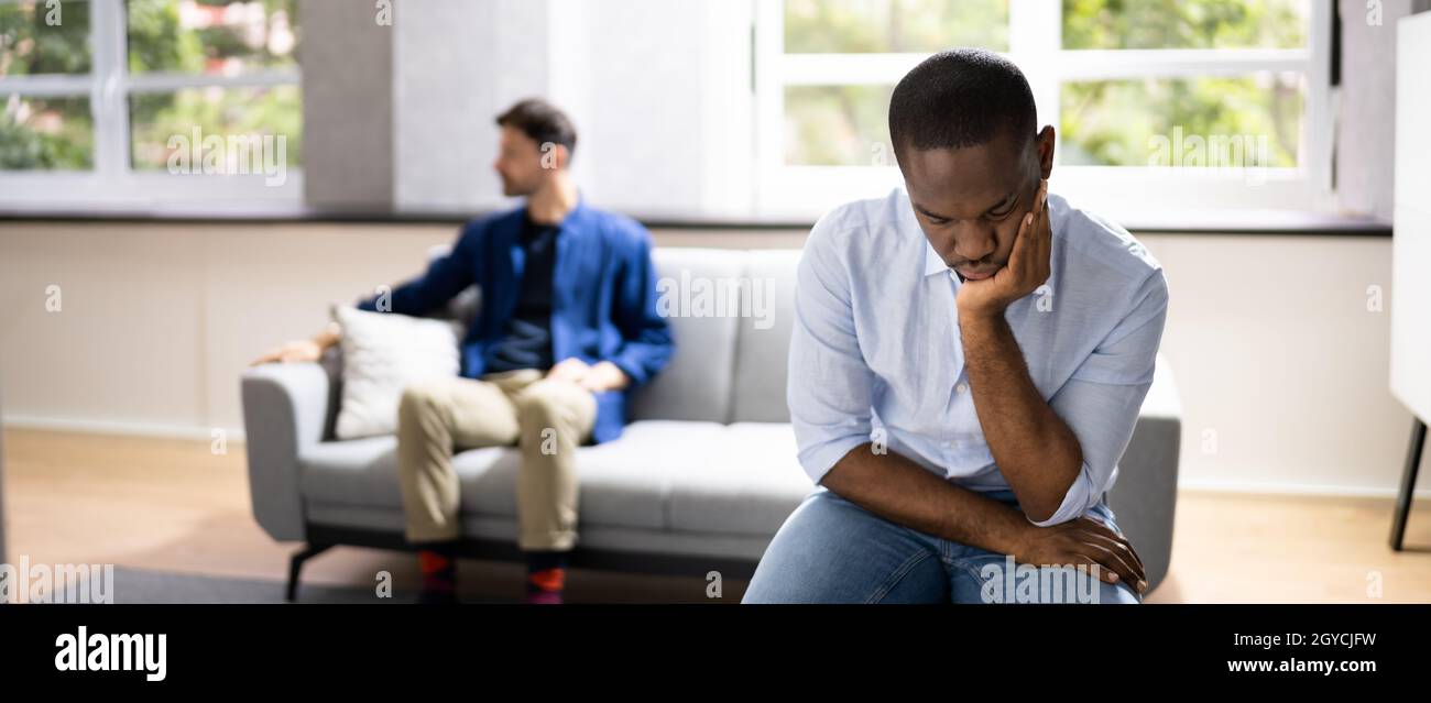 Gay Couple Relationship Conflict And Divorce. Unhappy And Sad Stock Photo