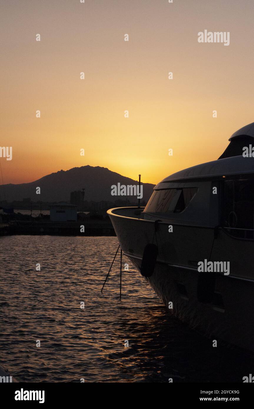 Beautiful view of marina di Olbia port and yacht marina at sunset Stock Photo