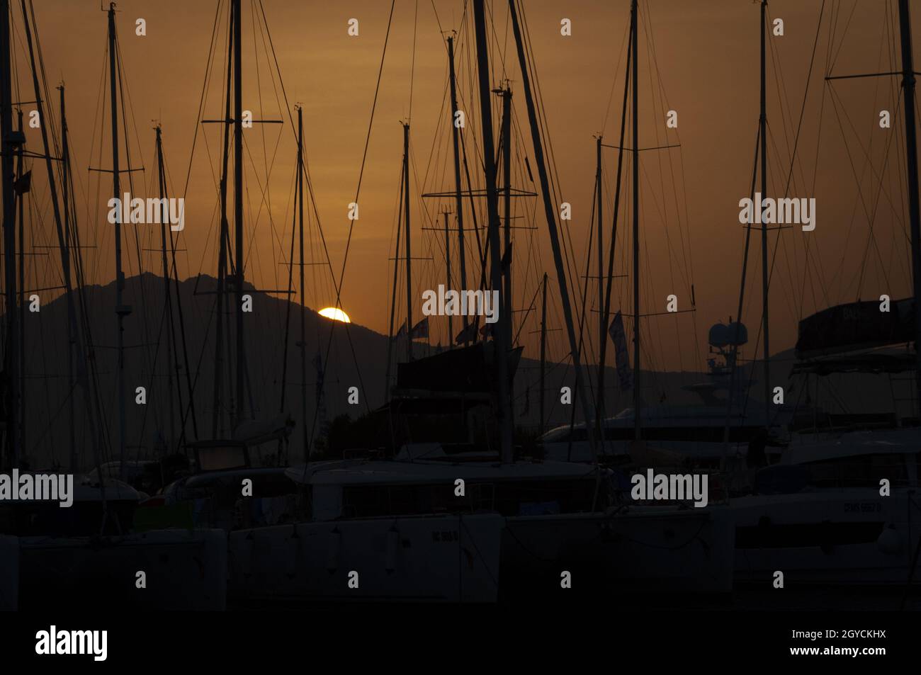 Beautiful view of marina di Olbia port and yacht marina at sunset Stock Photo