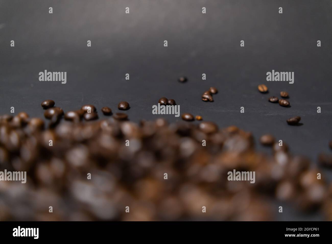Pile of roasted coffee beans with dark gray background Stock Photo - Alamy