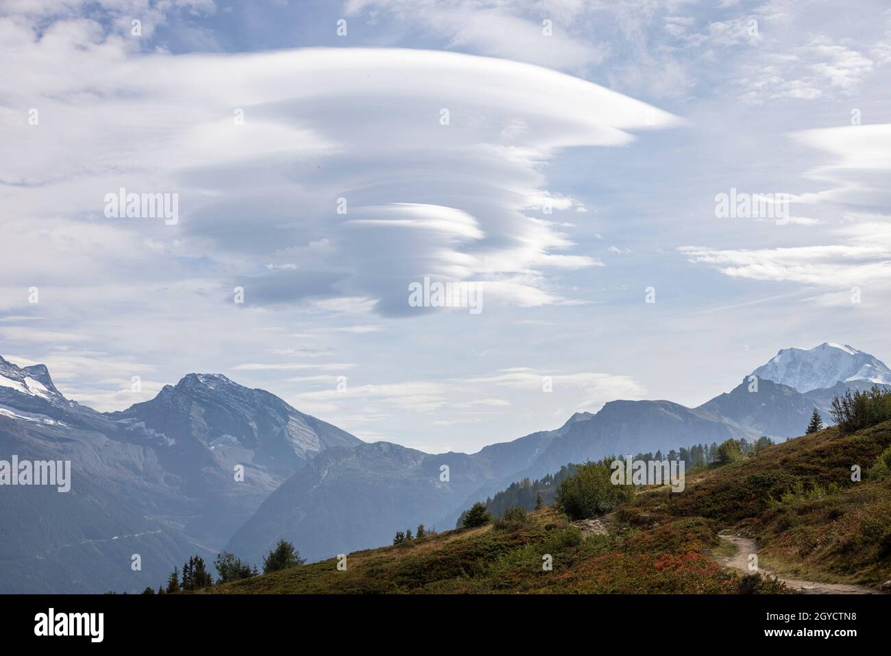 Lenticular cloud formation in a beautiful mountain landcape Stock Photo