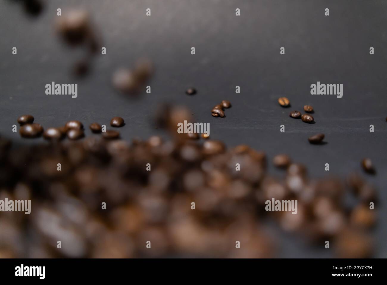 Pile of roasted coffee beans with dark gray background Stock Photo - Alamy