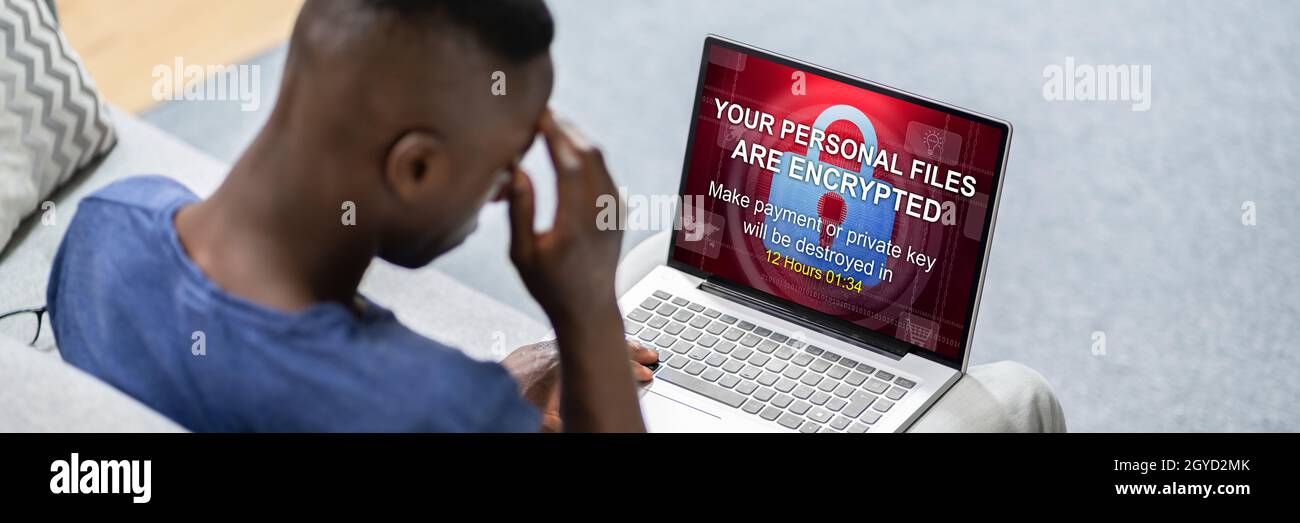 Ransomware Extortion Attack On Laptop. Cyber Security Stock Photo