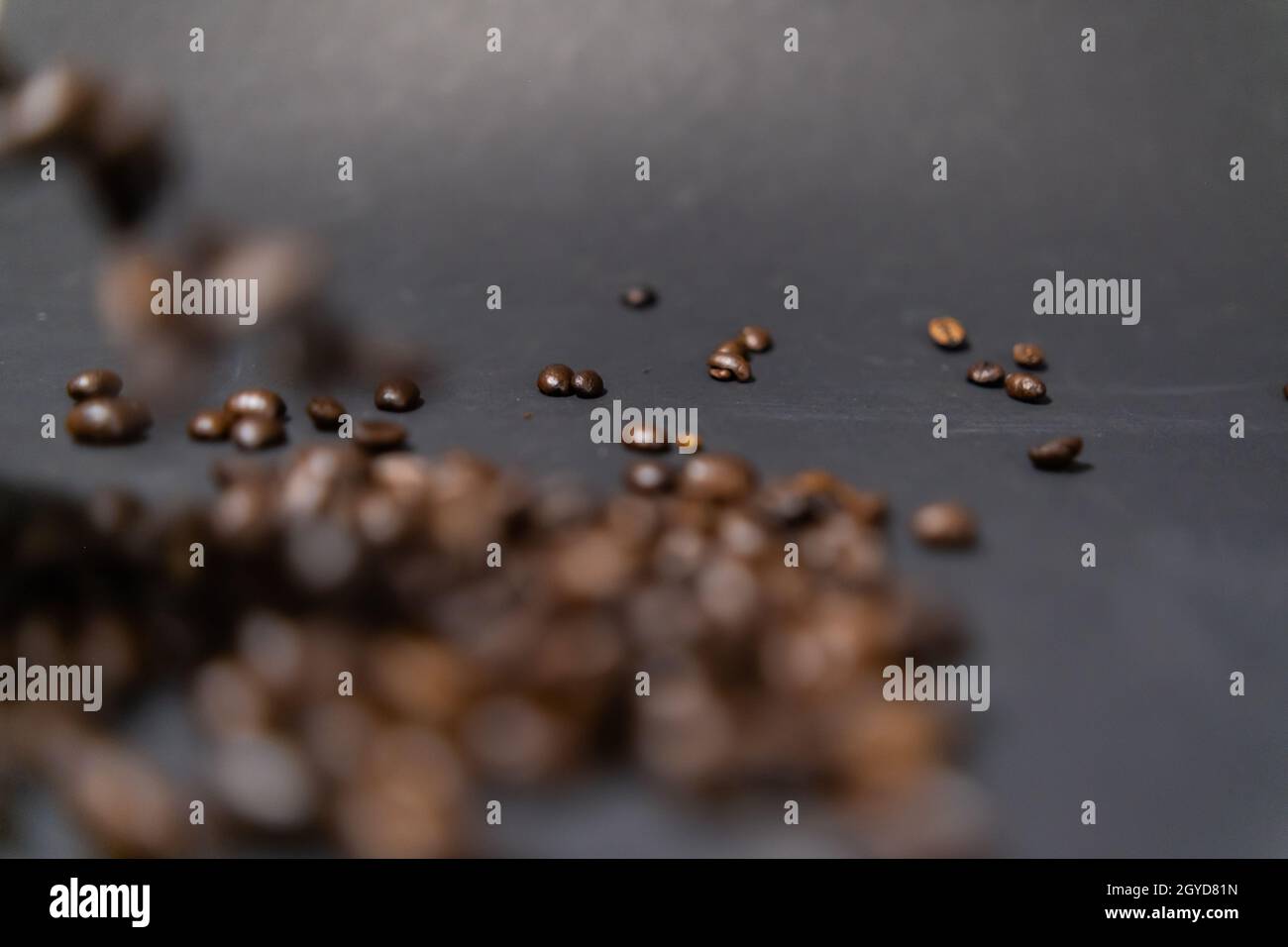 Pile of roasted coffee beans with dark gray background Stock Photo - Alamy