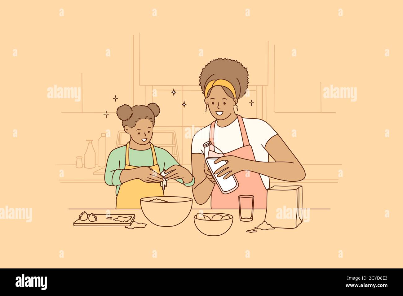 Cooking together and spending time with children concept. Young smiling beautiful African American woman mother and her daughter cooking in kitchen to Stock Photo