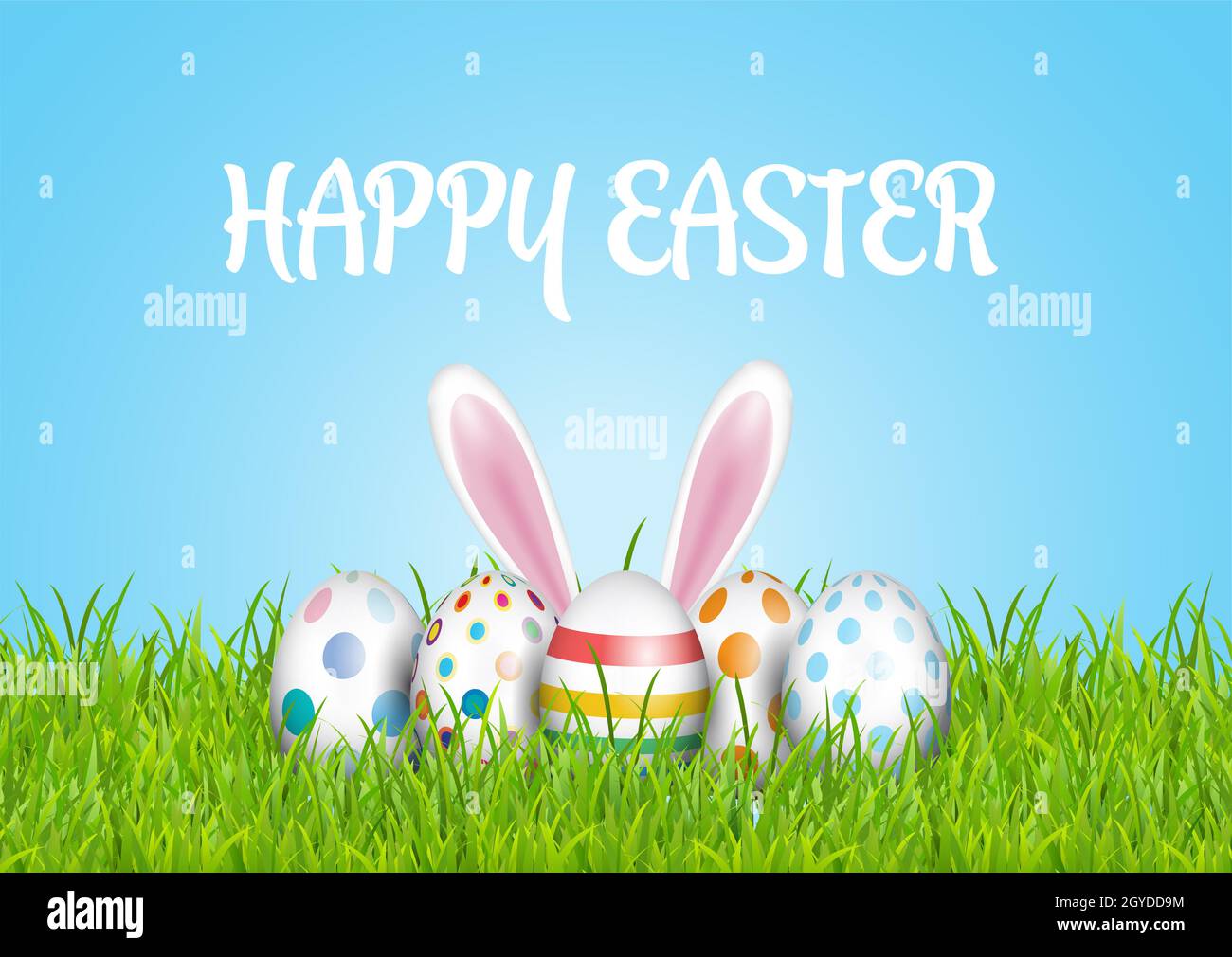 Cute Easter background with eggs and bunny nestled in grass Stock Photo