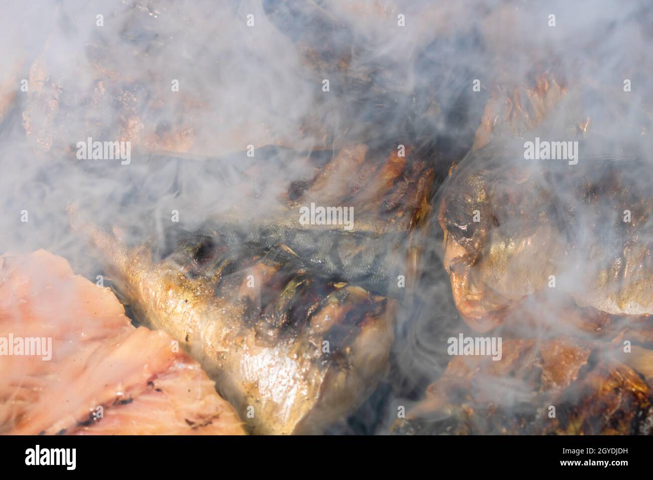 Grilled mackerel fish with smoke on a charcoal barbecue grill Stock Photo Alamy