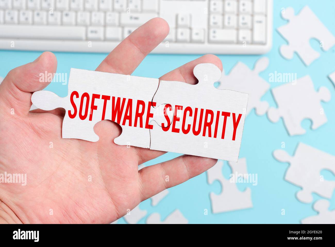 Conceptual display Software Security, Business approach implemented to protect software against malicious attack Building An Unfinished White Jigsaw P Stock Photo