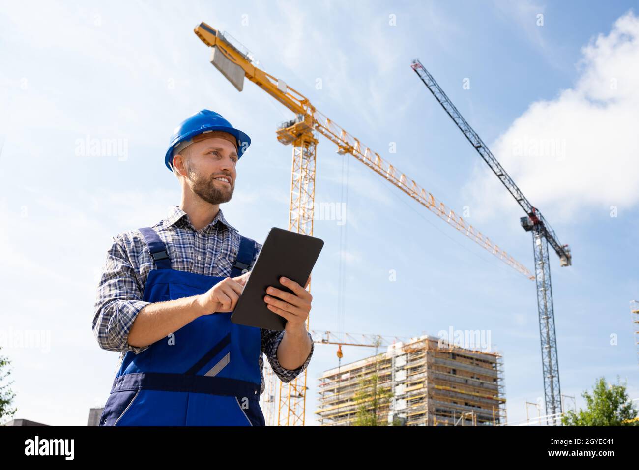 Construction Worker Or Engineer At Site Inspecting Stock Photo