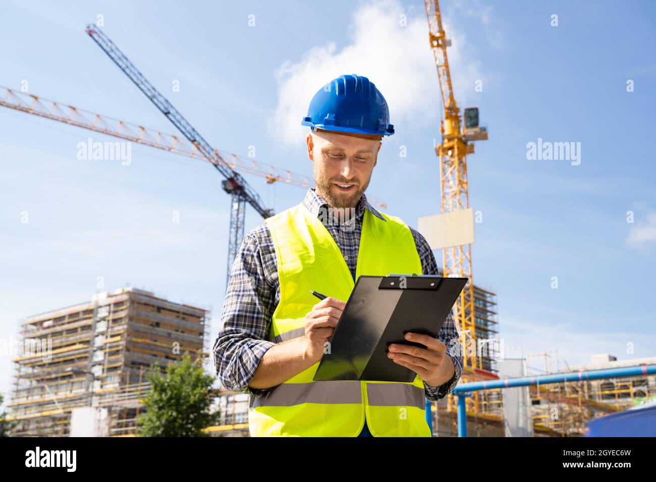 OSHA Inspector At Construction Site. Young Engineer Worker Stock Photo