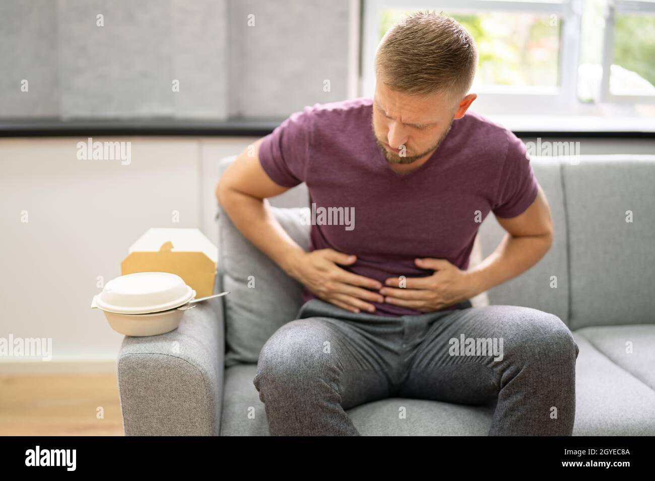 Unhealthy Fastfood Stomach Heartburn. Person After Eating Food Stock