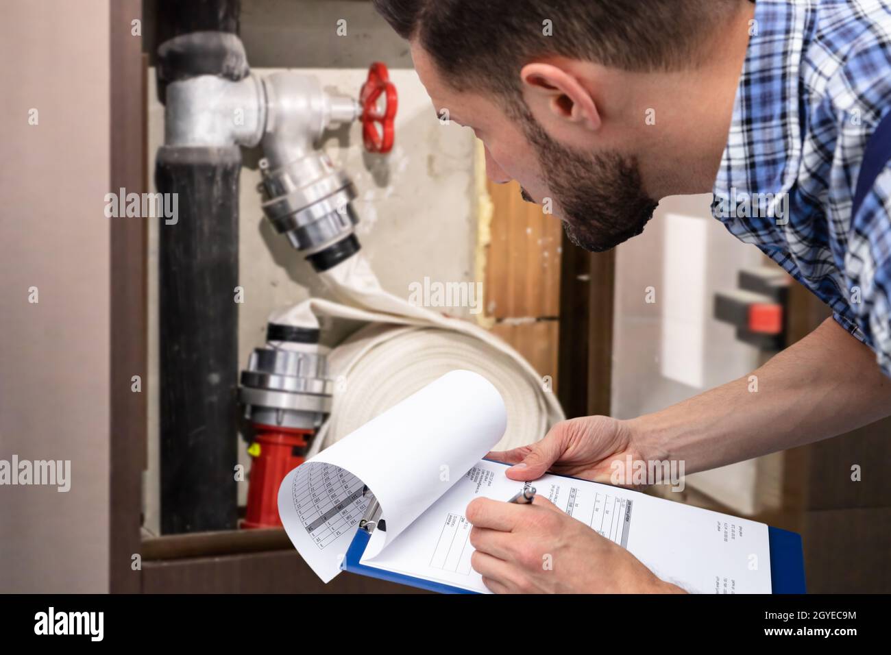 Fire Hose And Pipe Emergency Prevention And Safety System Check Stock Photo