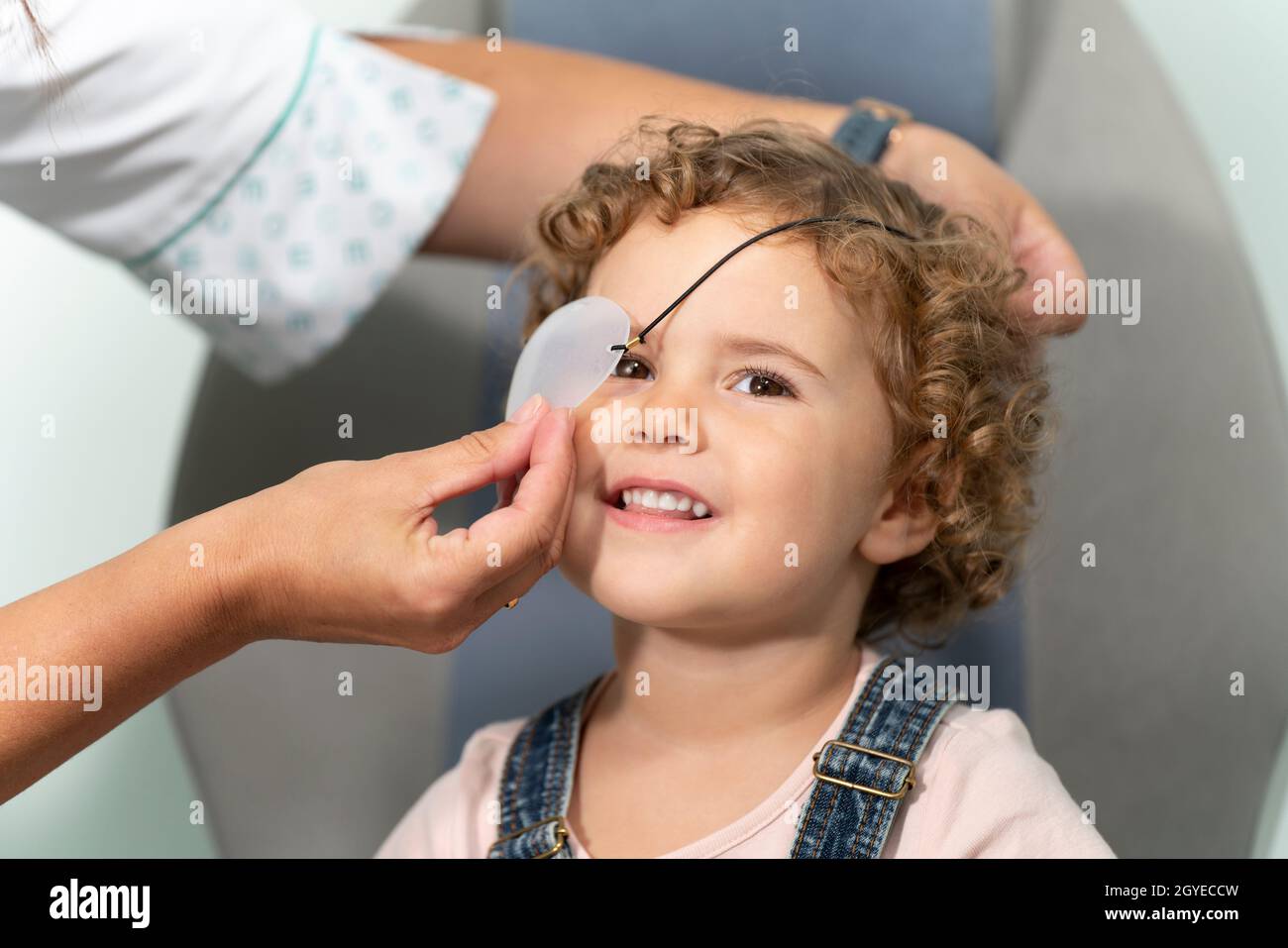Little girl with a patch at an optometrist consultation Stock Photo