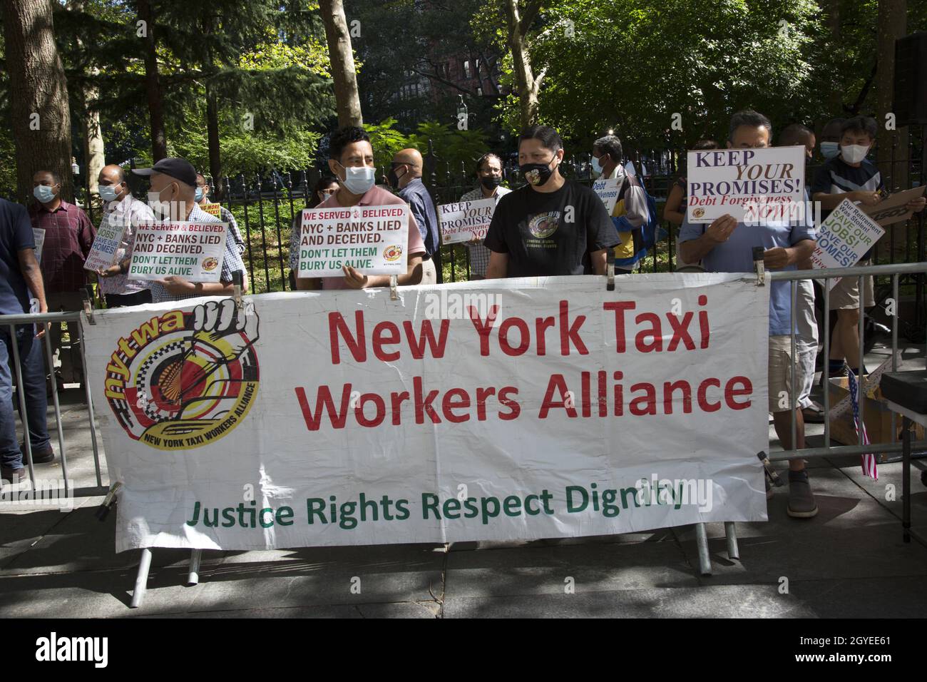 Yellow Cab Taxi Workers Alliance demands justice for drivers in terms of debt relief for expensive medallions for what they consider a city-manufactured crisis on Broadway by City Hall in Manhattan, NYC. Stock Photo