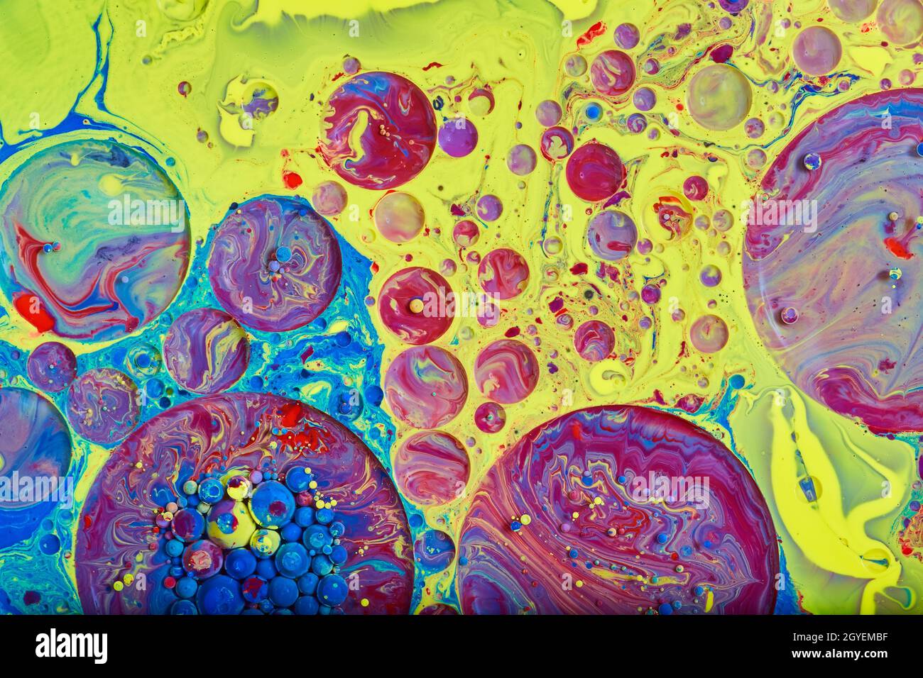 Circles and spheres on rainbow unicorn surface of liquid Stock Photo