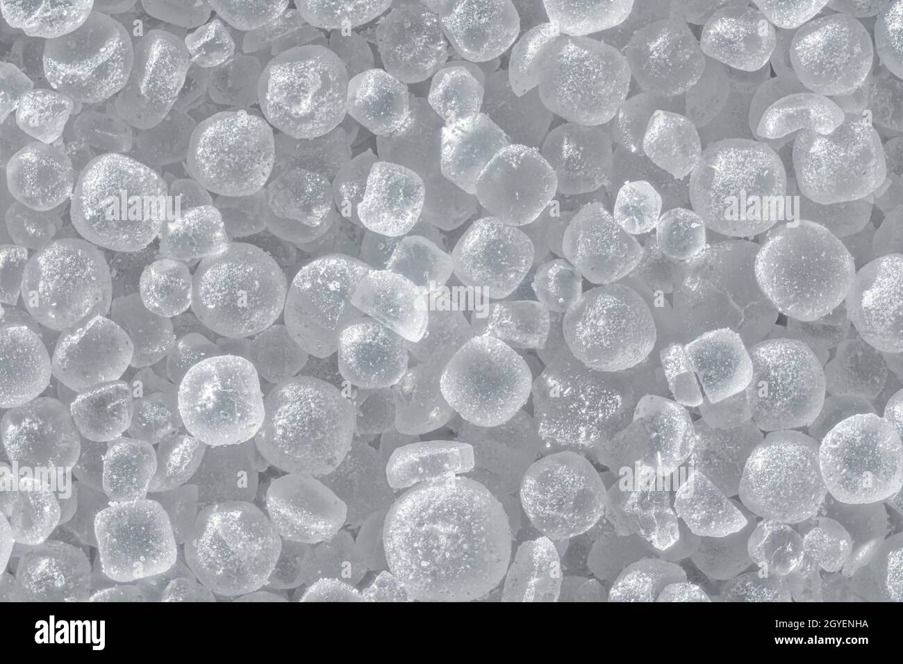 White table salt crystals under microscope, image width 9mm, abstract