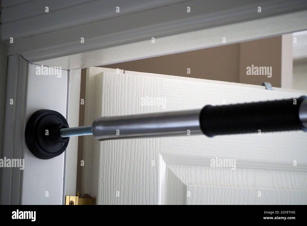 pullup bar installed between the door, pullup bar attached to the