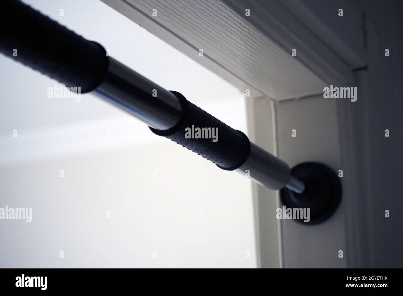 pullup bar installed between the door, pullup bar attached to the