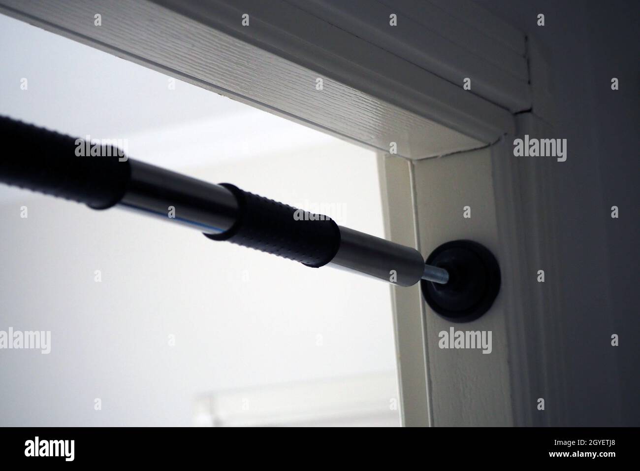pullup bar installed between the door, pullup bar attached to the