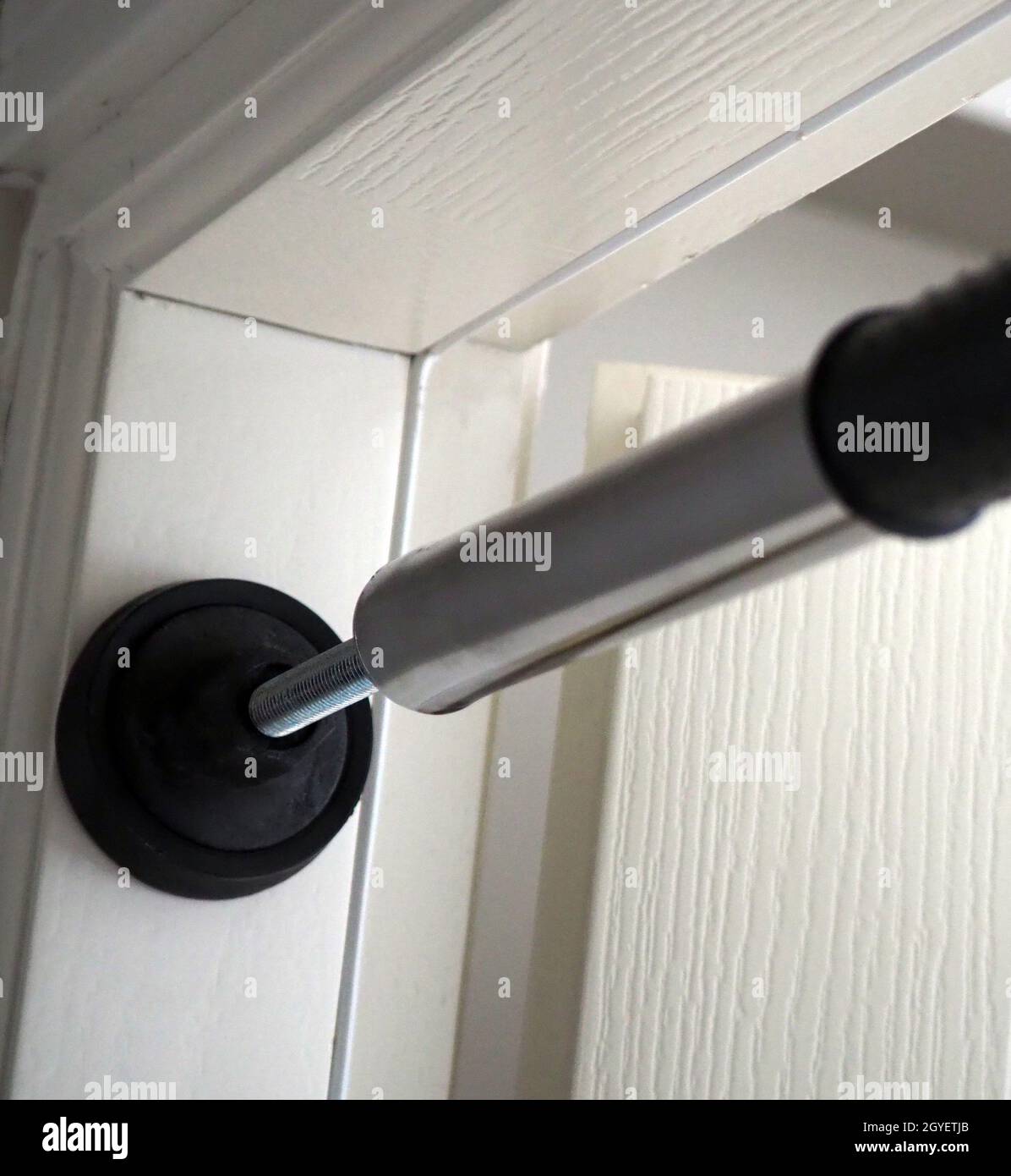 pullup bar installed between the door, pullup bar attached to the