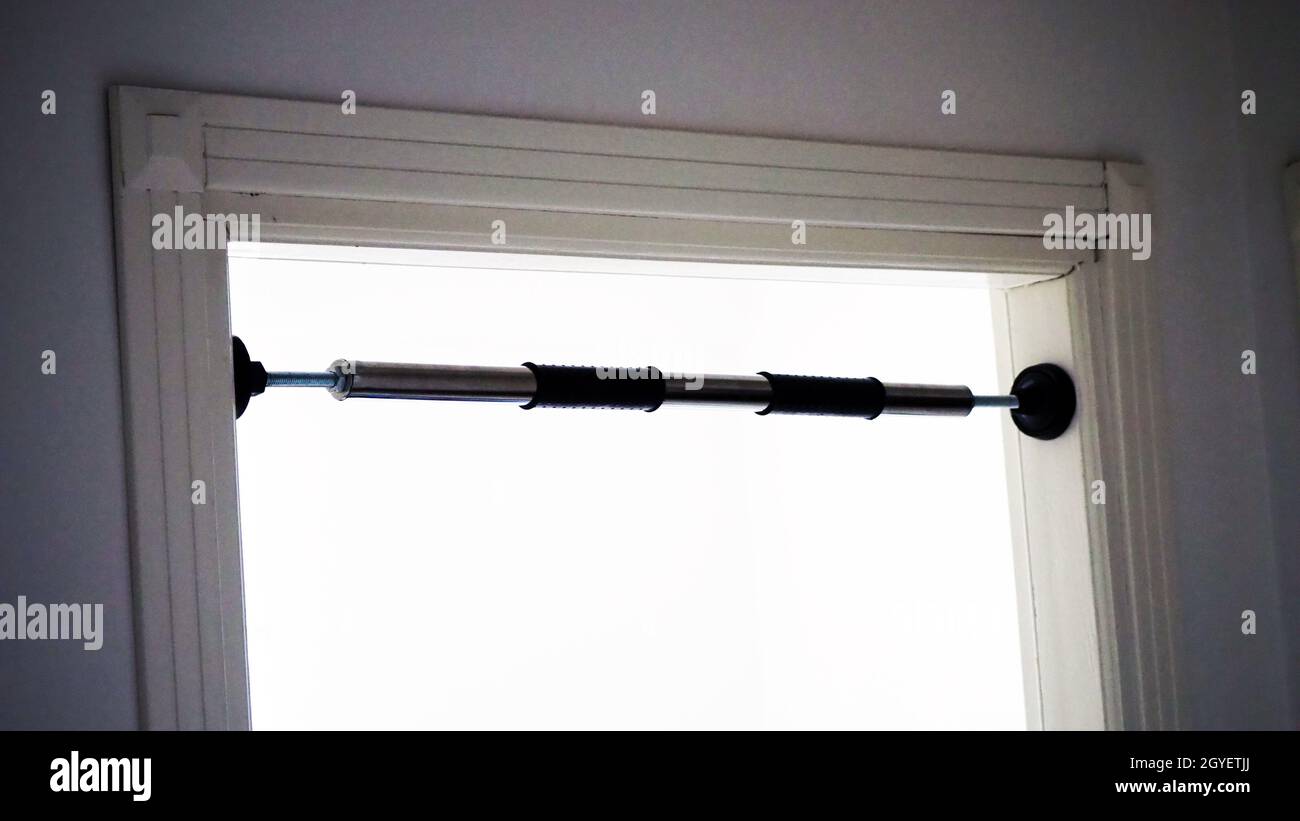 pullup bar installed between the door, pullup bar attached to the