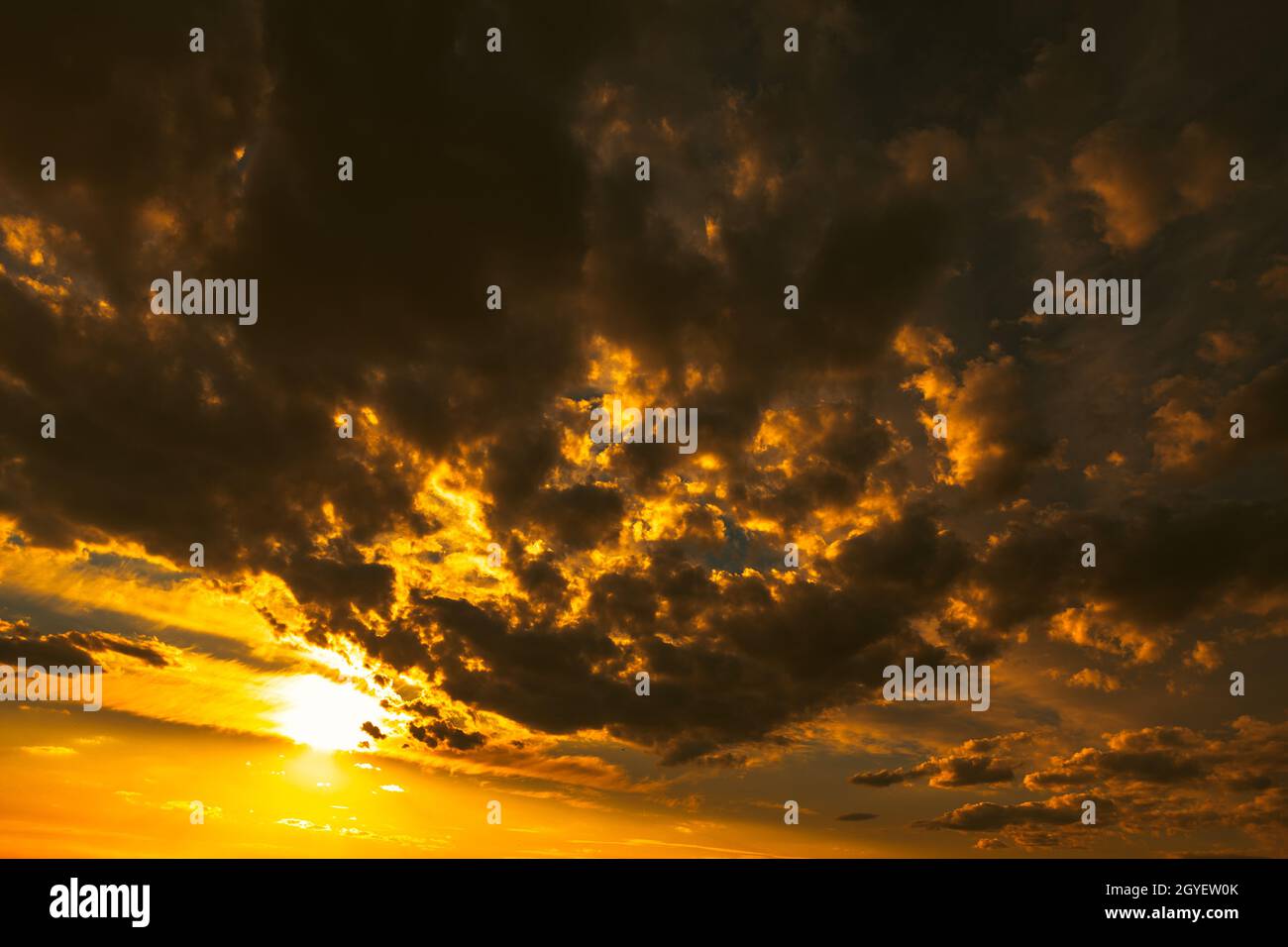 Golden sky with dark clouds . Dramatic sky with twilight Stock Photo ...