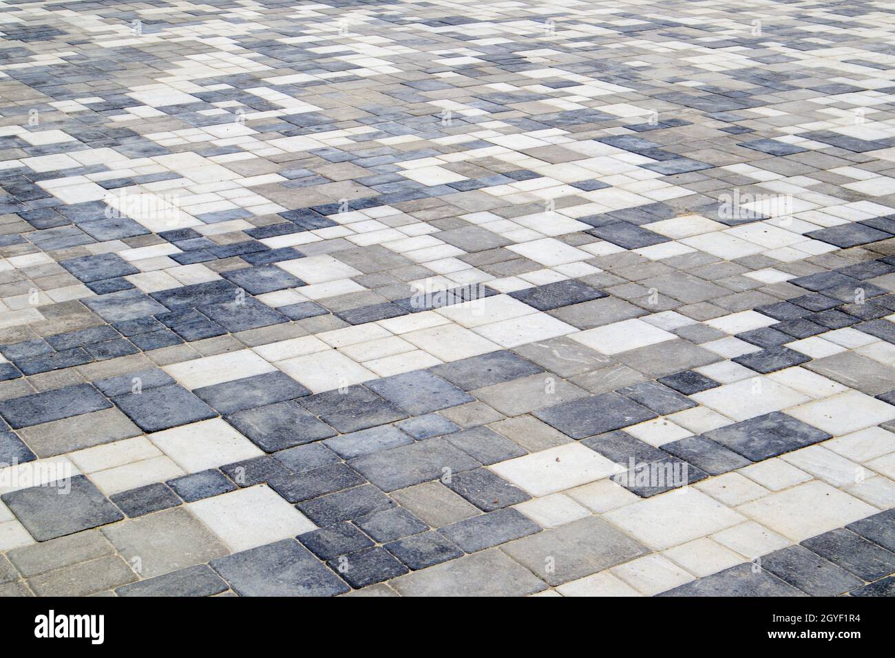 Concrete or paved newly laid gray paving slabs or stones for floors or