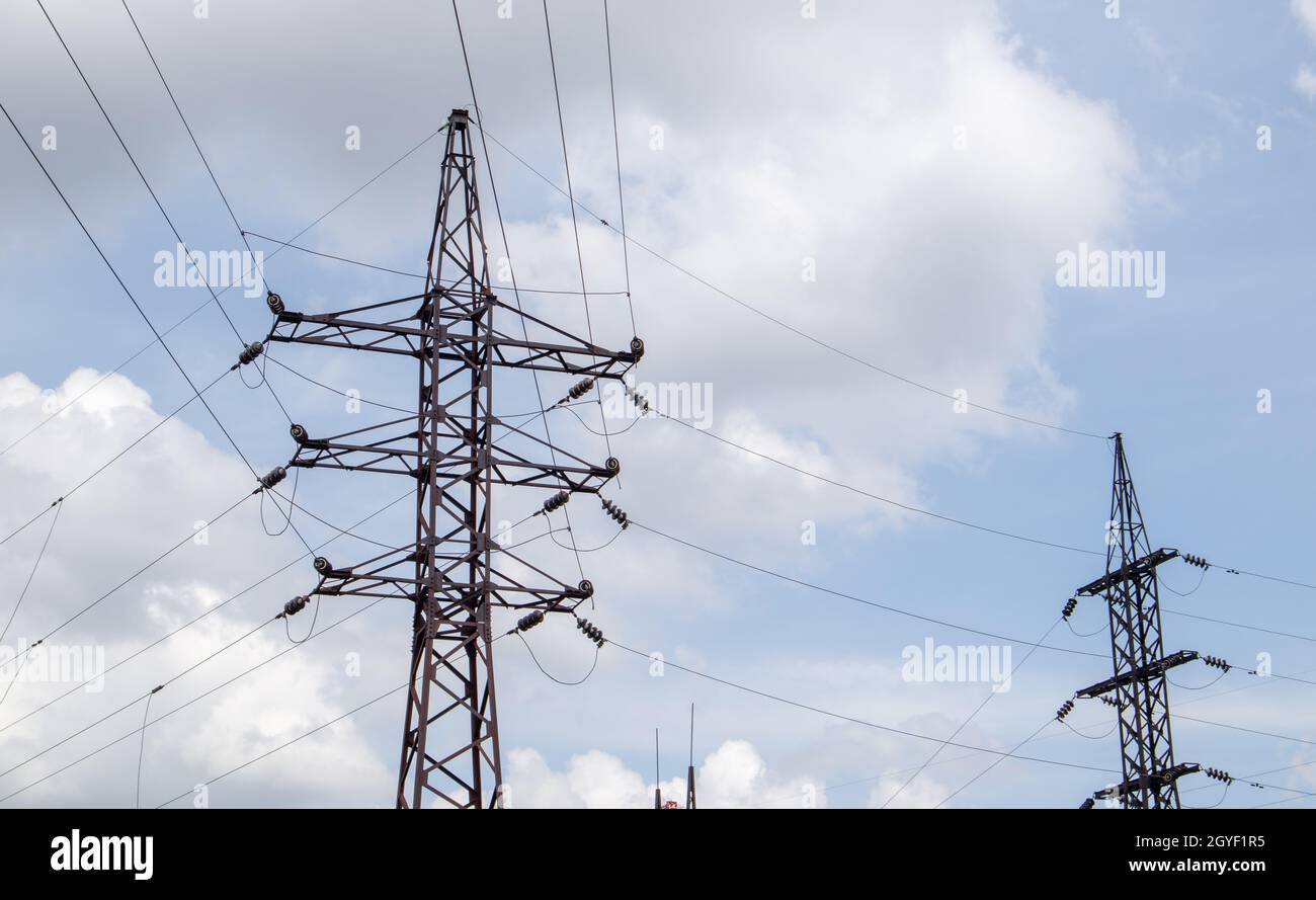 High voltage electrical tower. Power lines and power pylons on a sunny ...