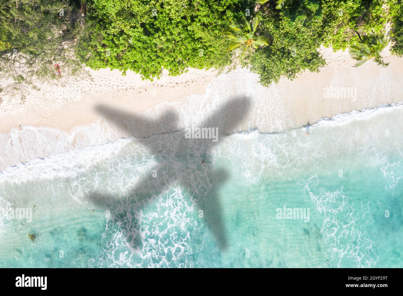 Beach travel traveling vacation sea symbolic picture airplane flying flight Seychelles water image Stock Photo