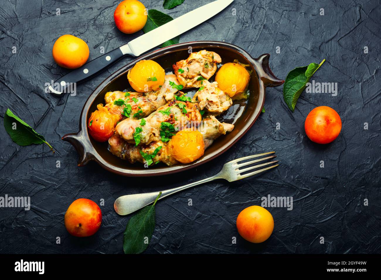 Chicken leg stuffed with mushroom and cherry plum. Baked meat dish with