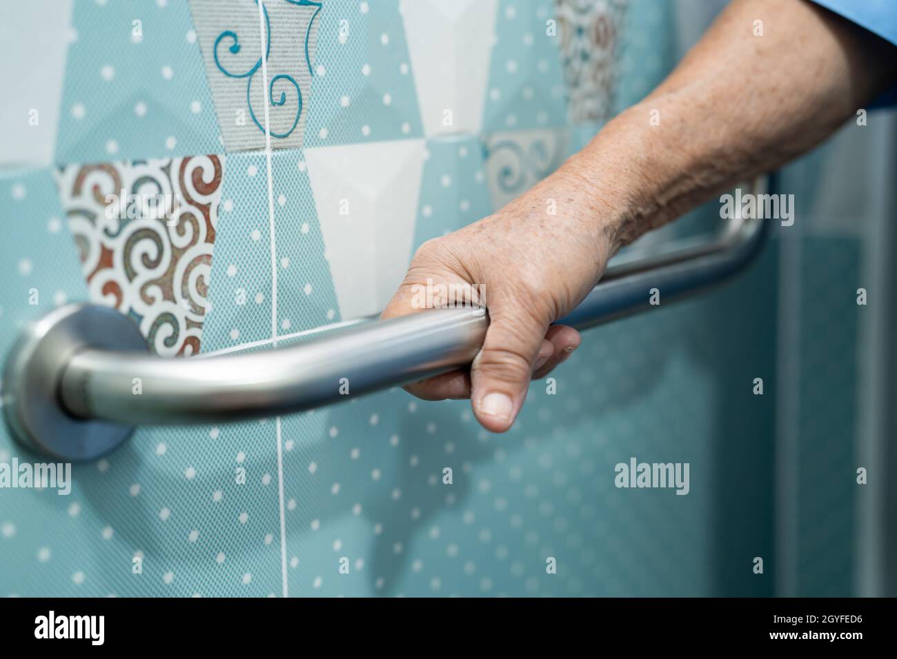 Asian senior or elderly old lady woman patient use toilet bathroom handle security in nursing hospital ward, healthy strong medical concept. Stock Photo