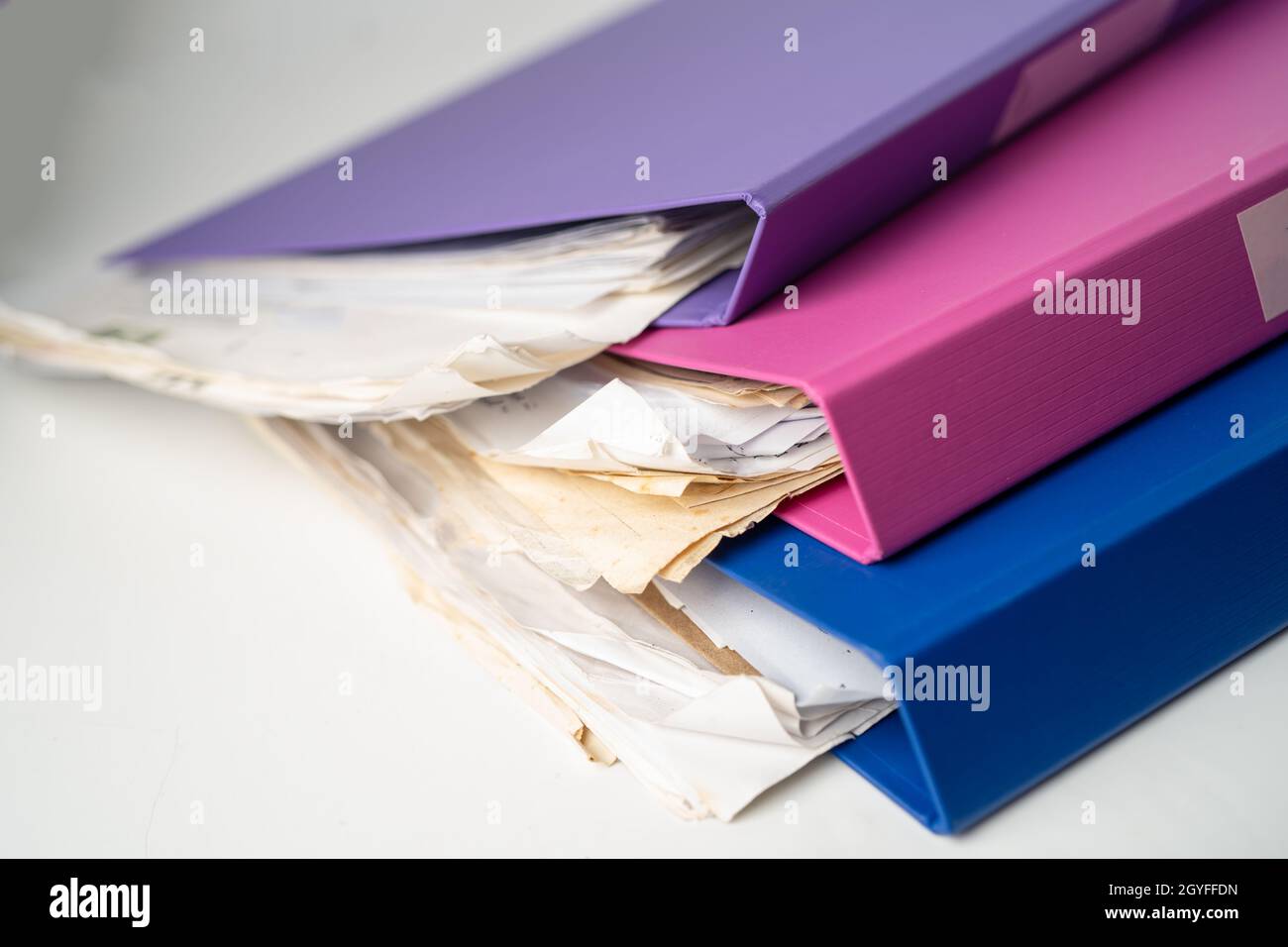 File Folder Binder stack of multi color on table in office. Stock Photo