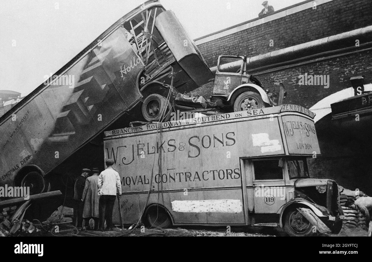 Heavy vehicles piled on top of each other after an air-raid during the Blitz, London 1940 Stock Photo