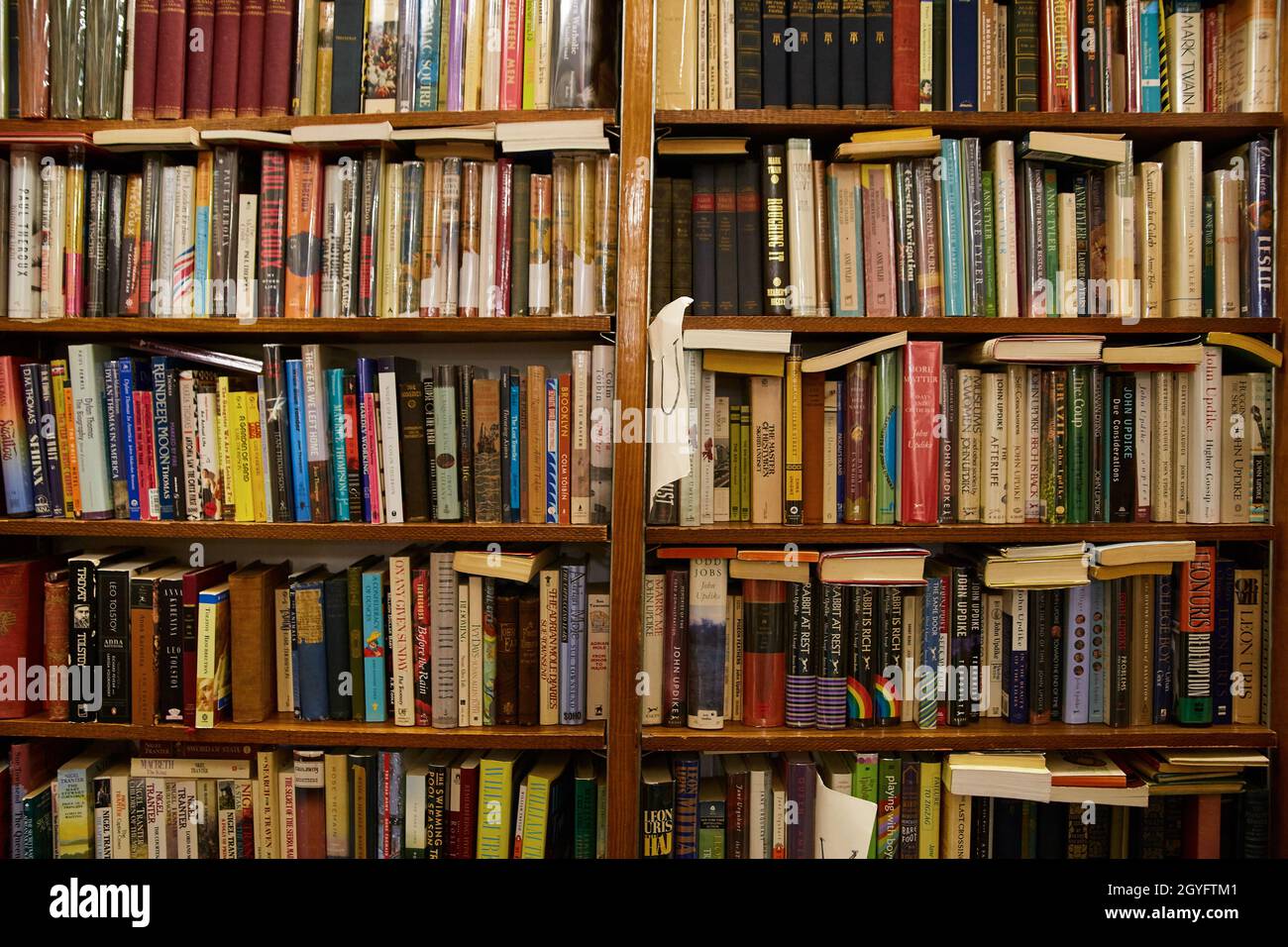 Wall of bookshelves in bookstore full of books Stock Photo Alamy