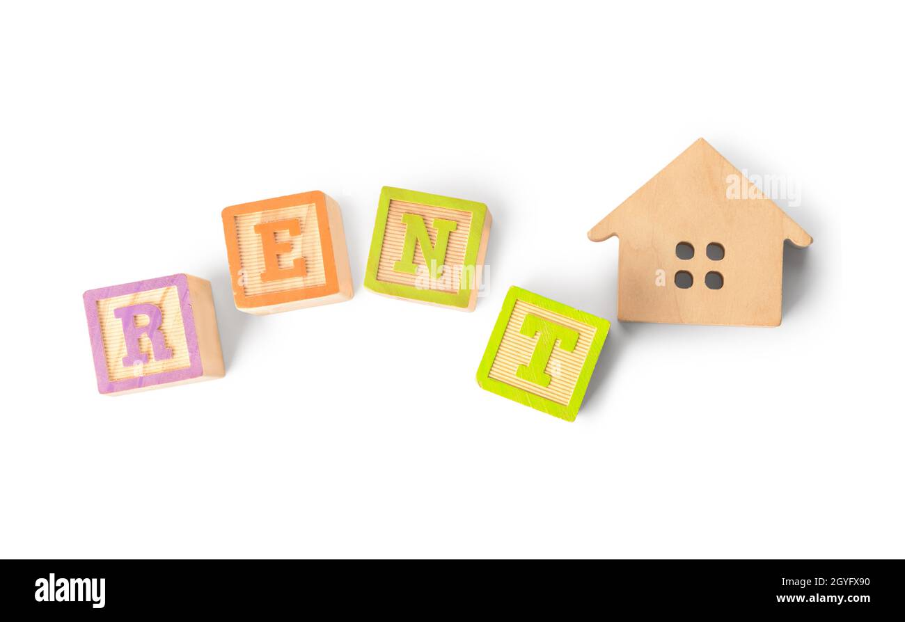 Wooden house and word RENT on white background Stock Photo - Alamy