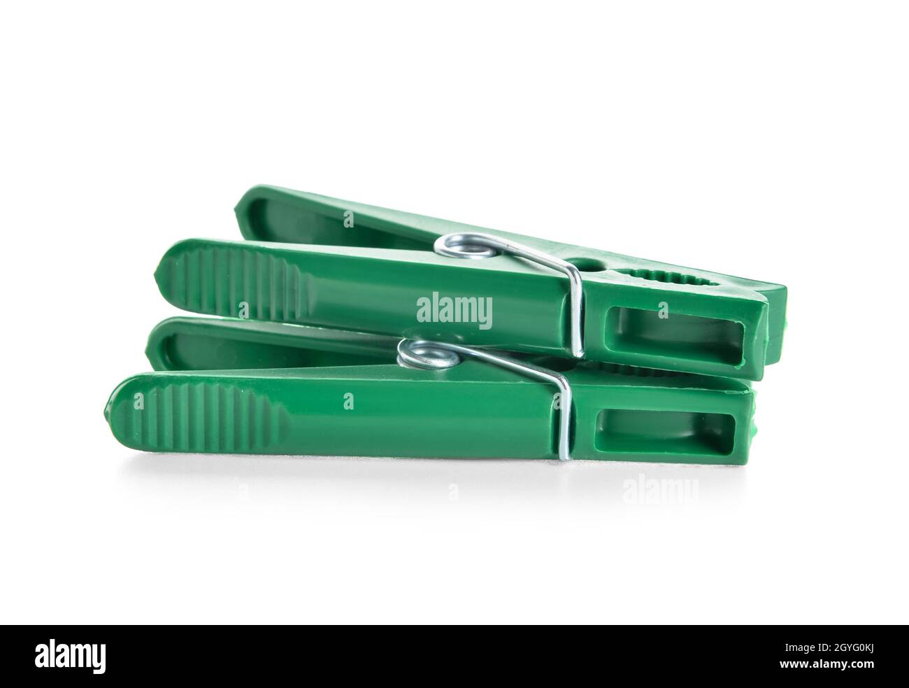Green plastic clothespins isolated on white background Stock Photo Alamy