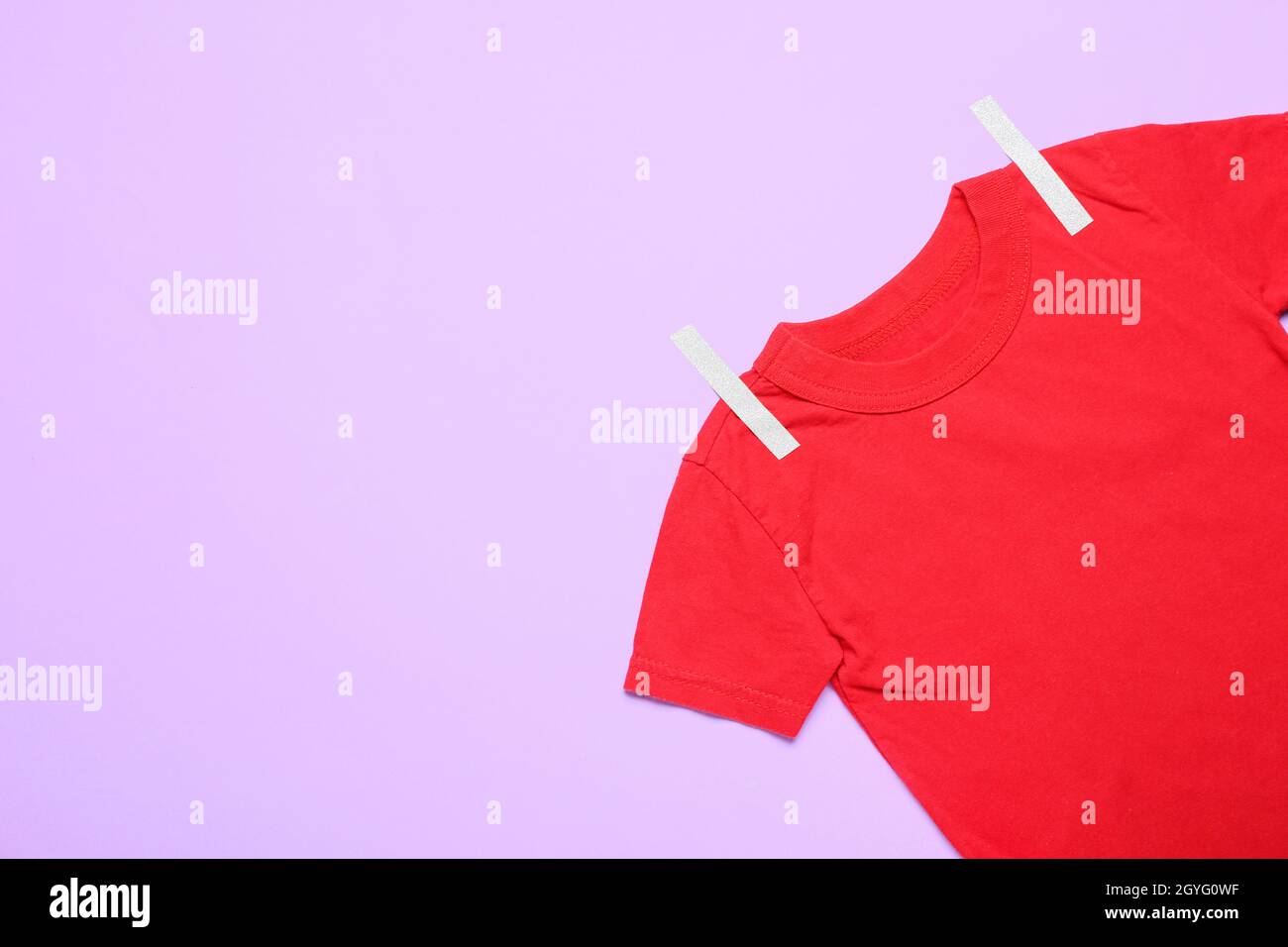Red t-shirt with paper-cut clothespins on color background, closeup Stock  Photo - Alamy