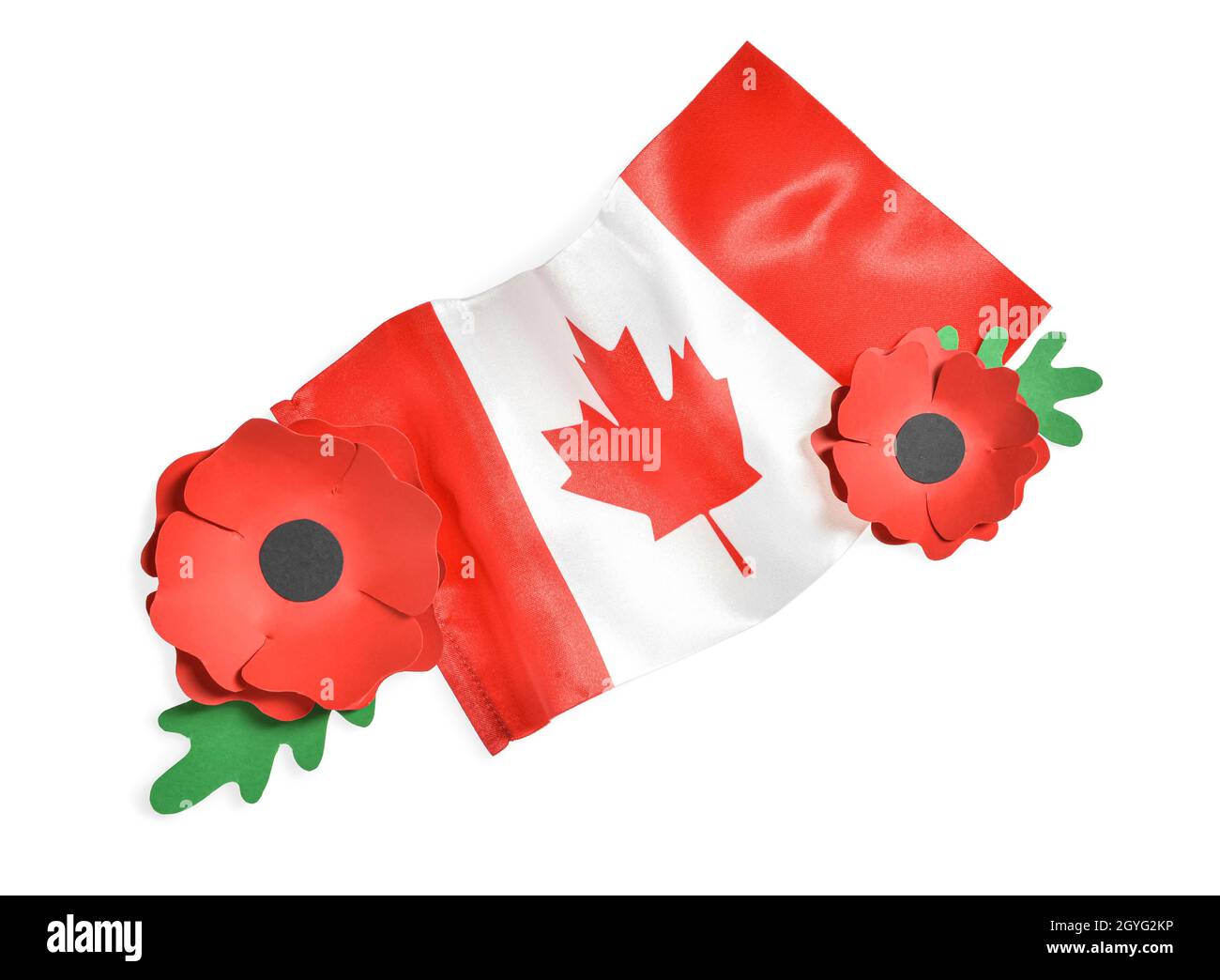 Paper poppy flowers and flag of Canada on white background. Remembrance