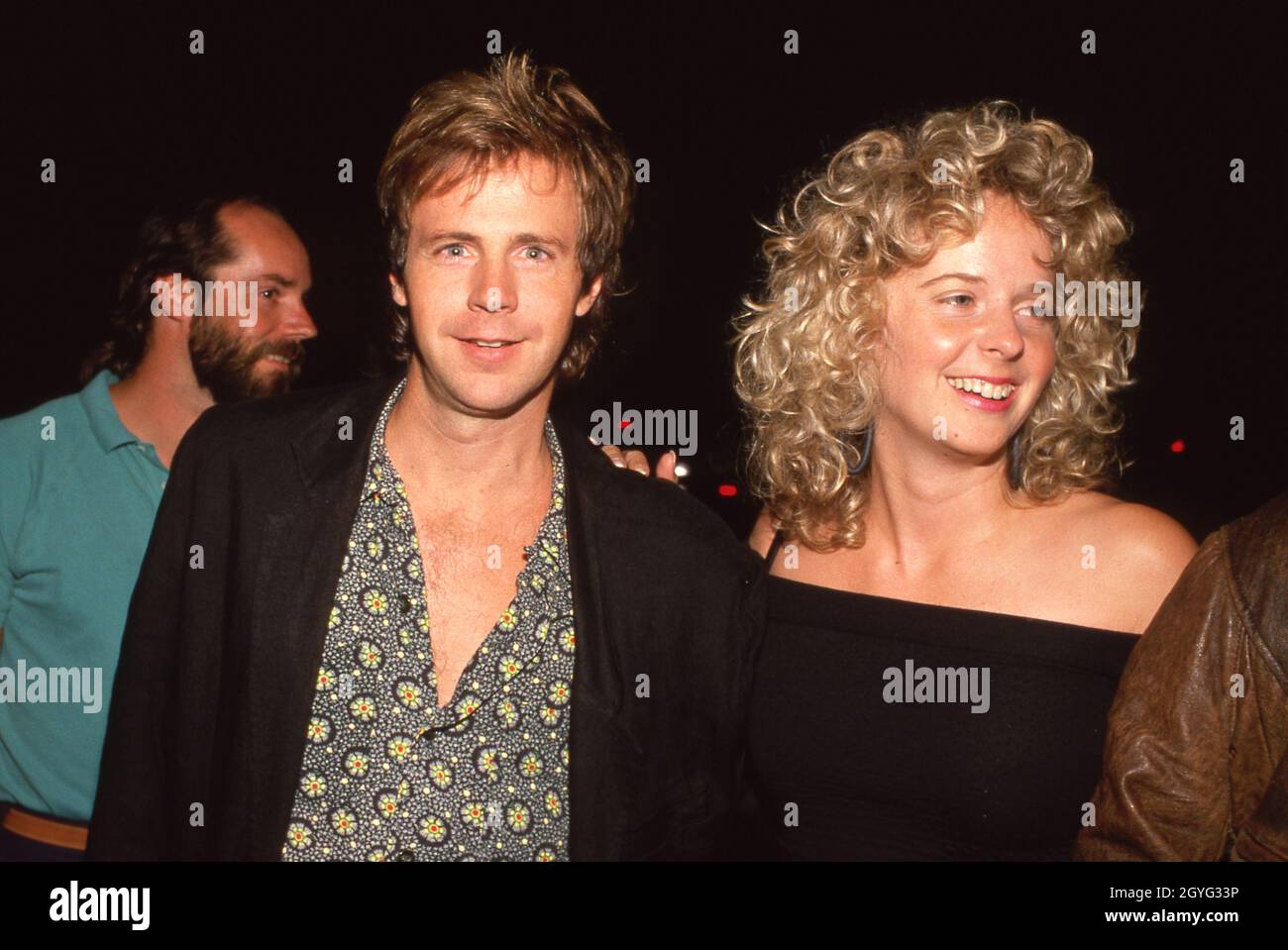 Dana Carvey and wife Paula Swaggerman and Jon Lovitz being photographed
