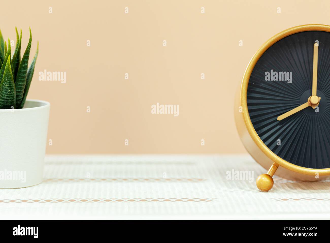 Alarm clock on wooden table close up Stock Photo