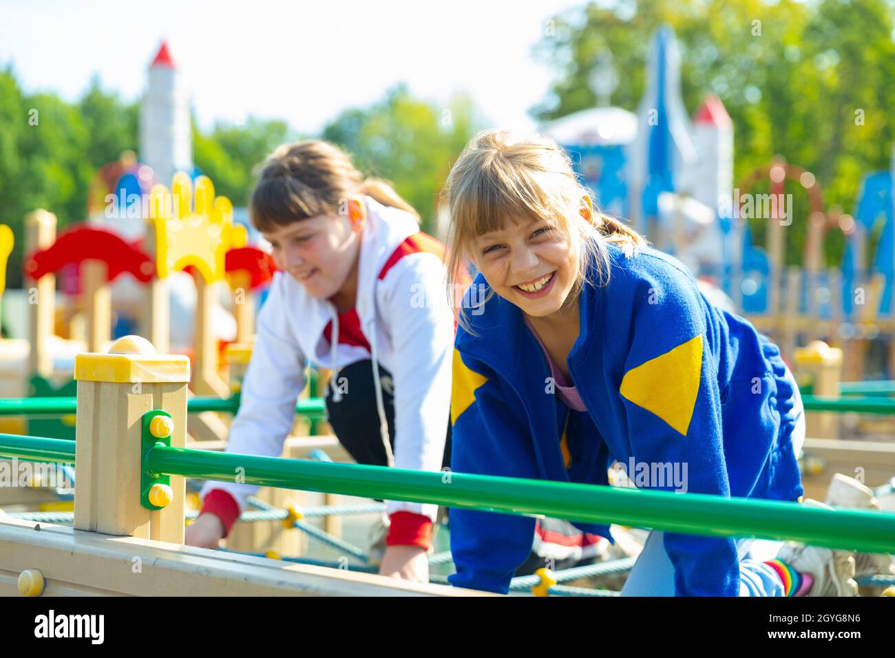 Two young girls on playground Stock Photo - Alamy