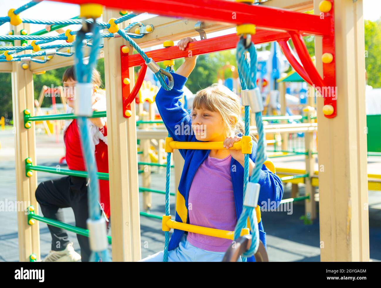 Two young girls on playground Stock Photo - Alamy