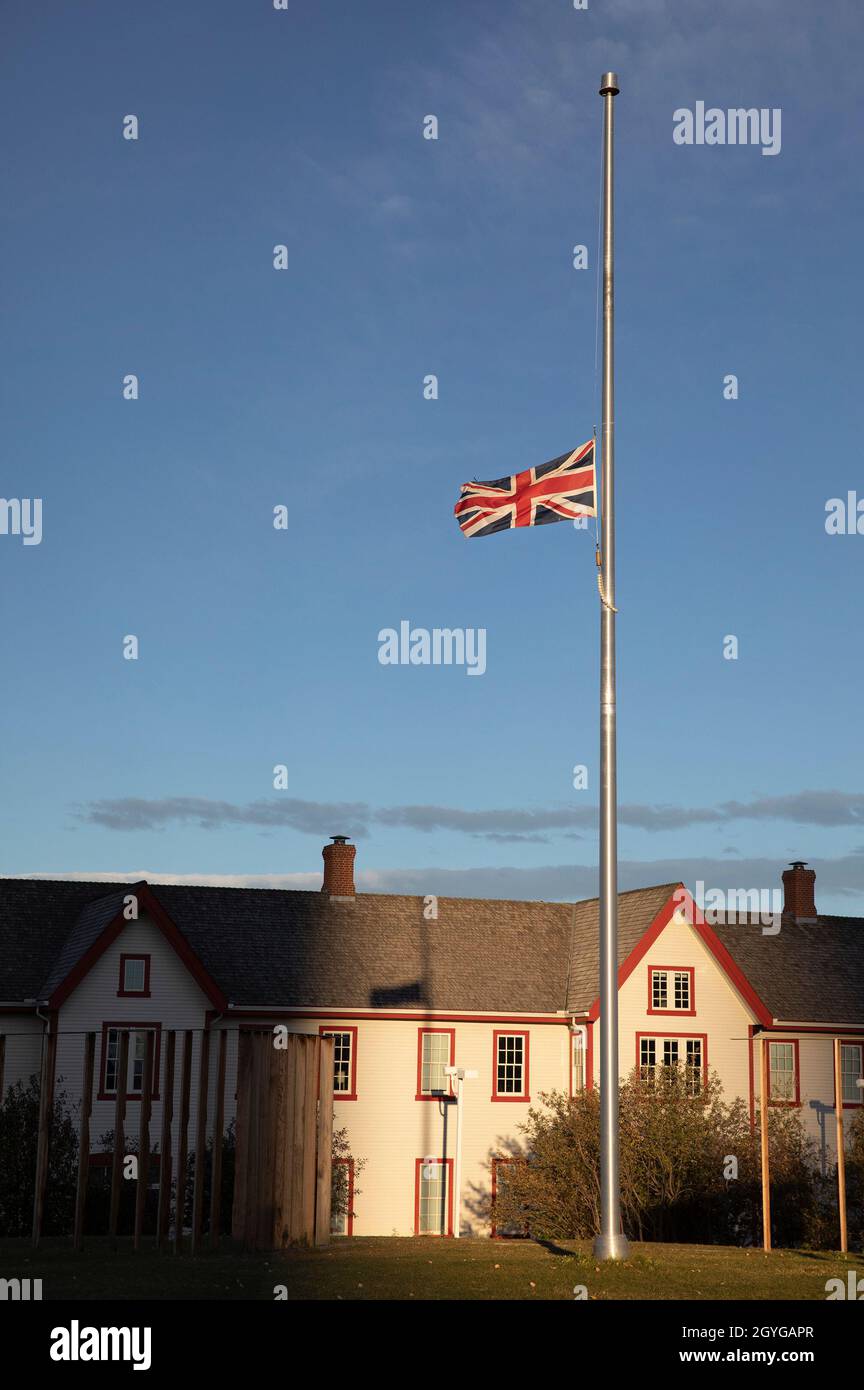 Union Jack flag flies at half mast over Fort Calgary in remembrance of indigenous children on the National Day For Truth And Reconciliation in Canada Stock Photo