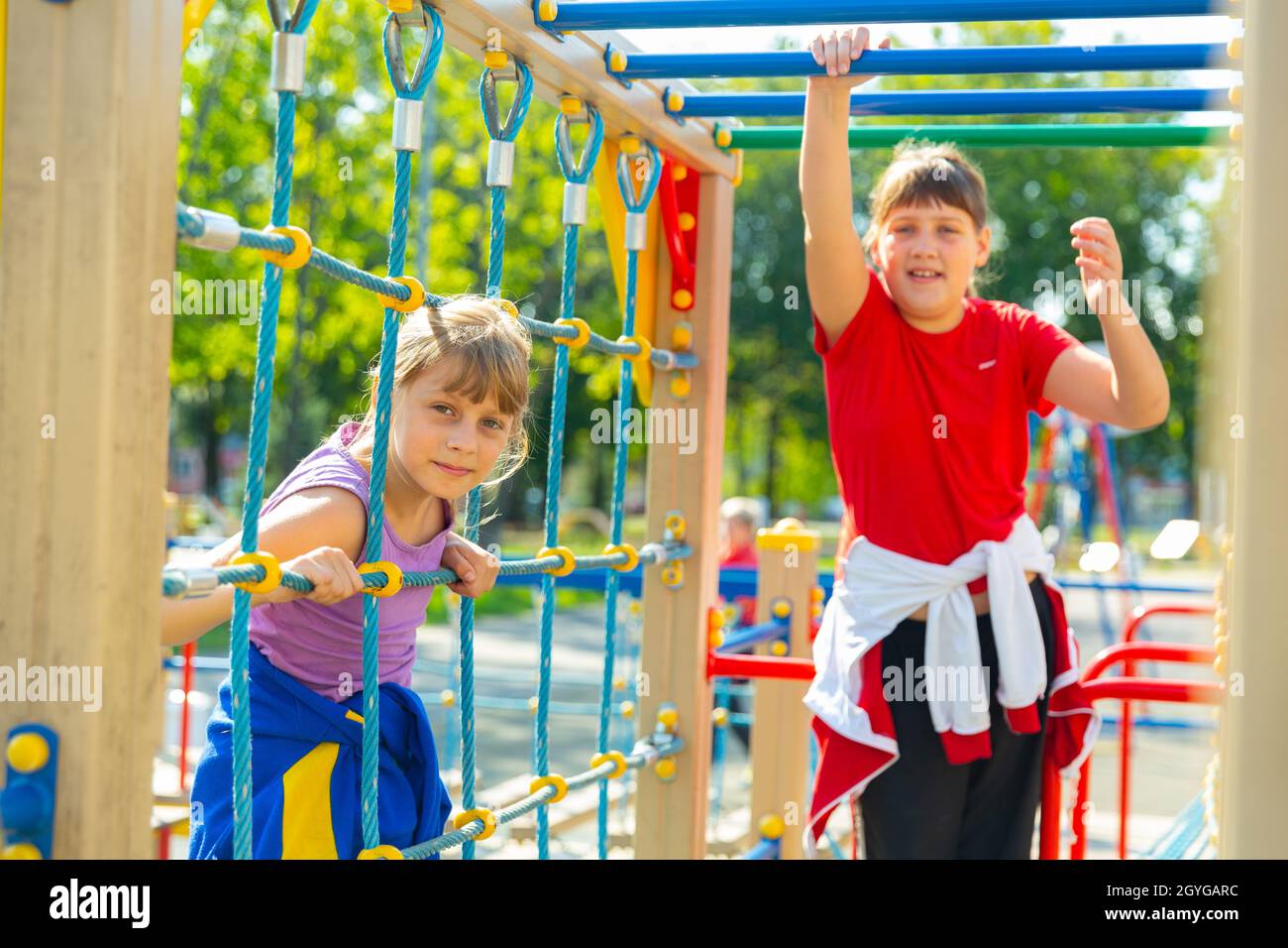 Portraits of two teenage girls on the playground Stock Photo - Alamy